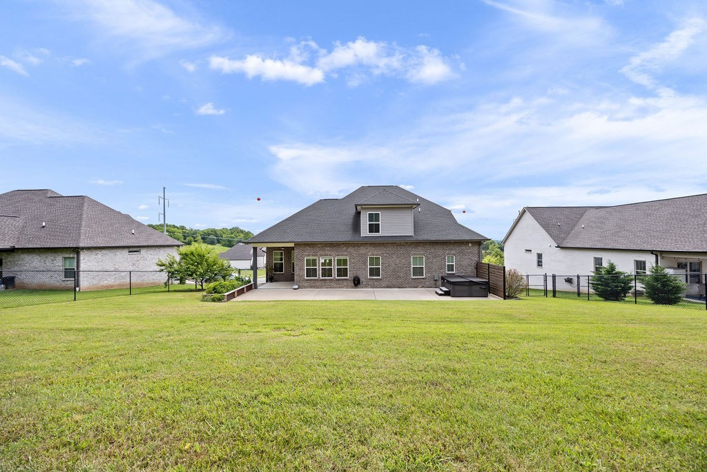 147 Enoch Way Gallatin, TN 37066 - Photo 48 of 60 a front view of a house with a yard and garage
