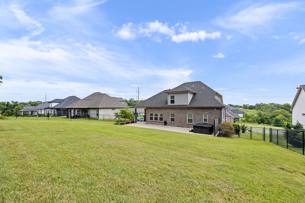 147 Enoch Way Gallatin, TN 37066 - Photo 49 of 60 a front view of a house with yard and porch