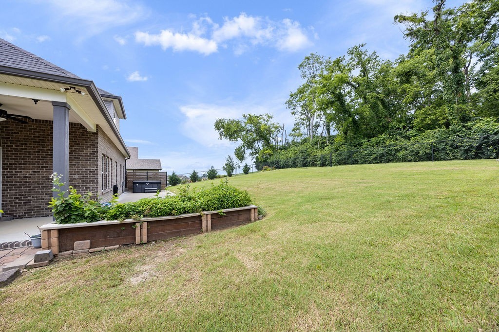 147 Enoch Way Gallatin, TN 37066 - Photo 52 of 60 a backyard of a house with lots of green space