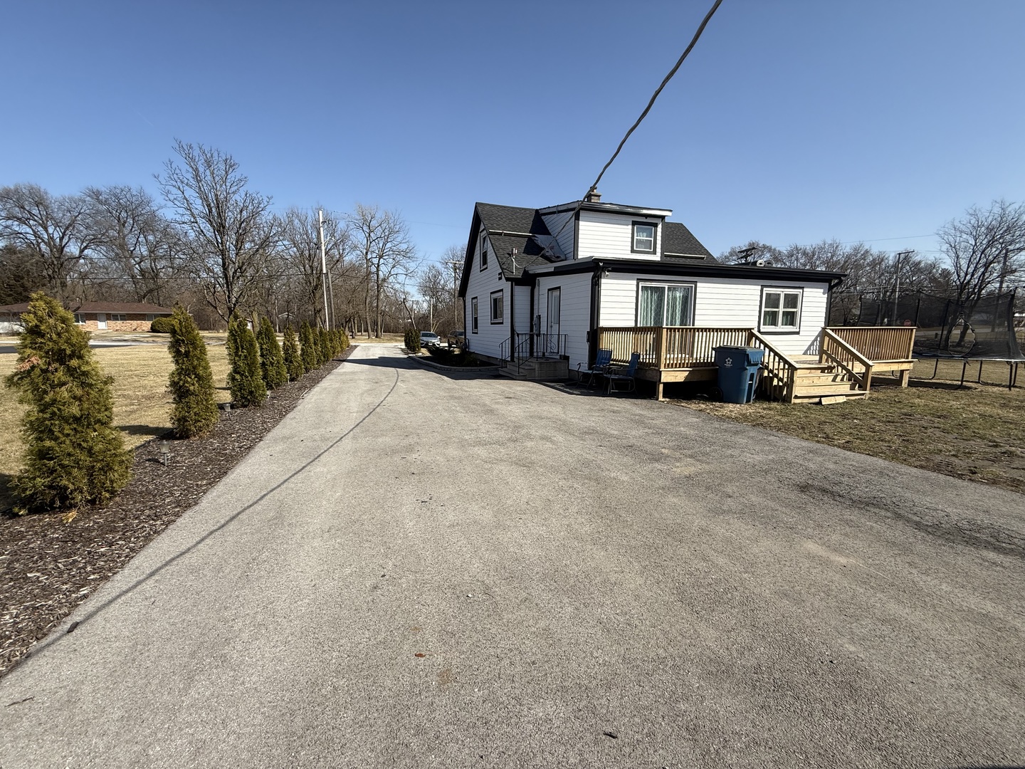 14280 Linder Avenue Midlothian, IL 60445 - Photo 2 of 19 a big house with large trees and outdoor space