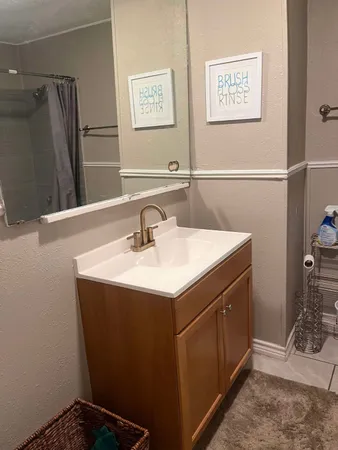 a bathroom with a sink and a mirror