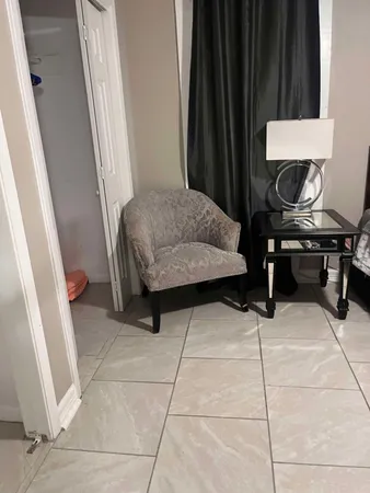 a living room with furniture and a window