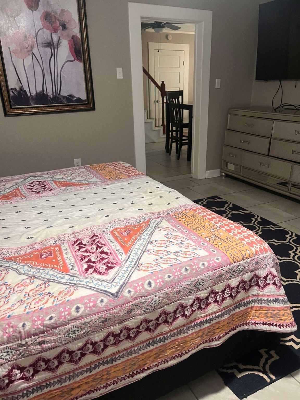 435 East Ave J Silsbee, TX 77656 - Photo 7 of 34 a bedroom with a bed and a painting on the wall