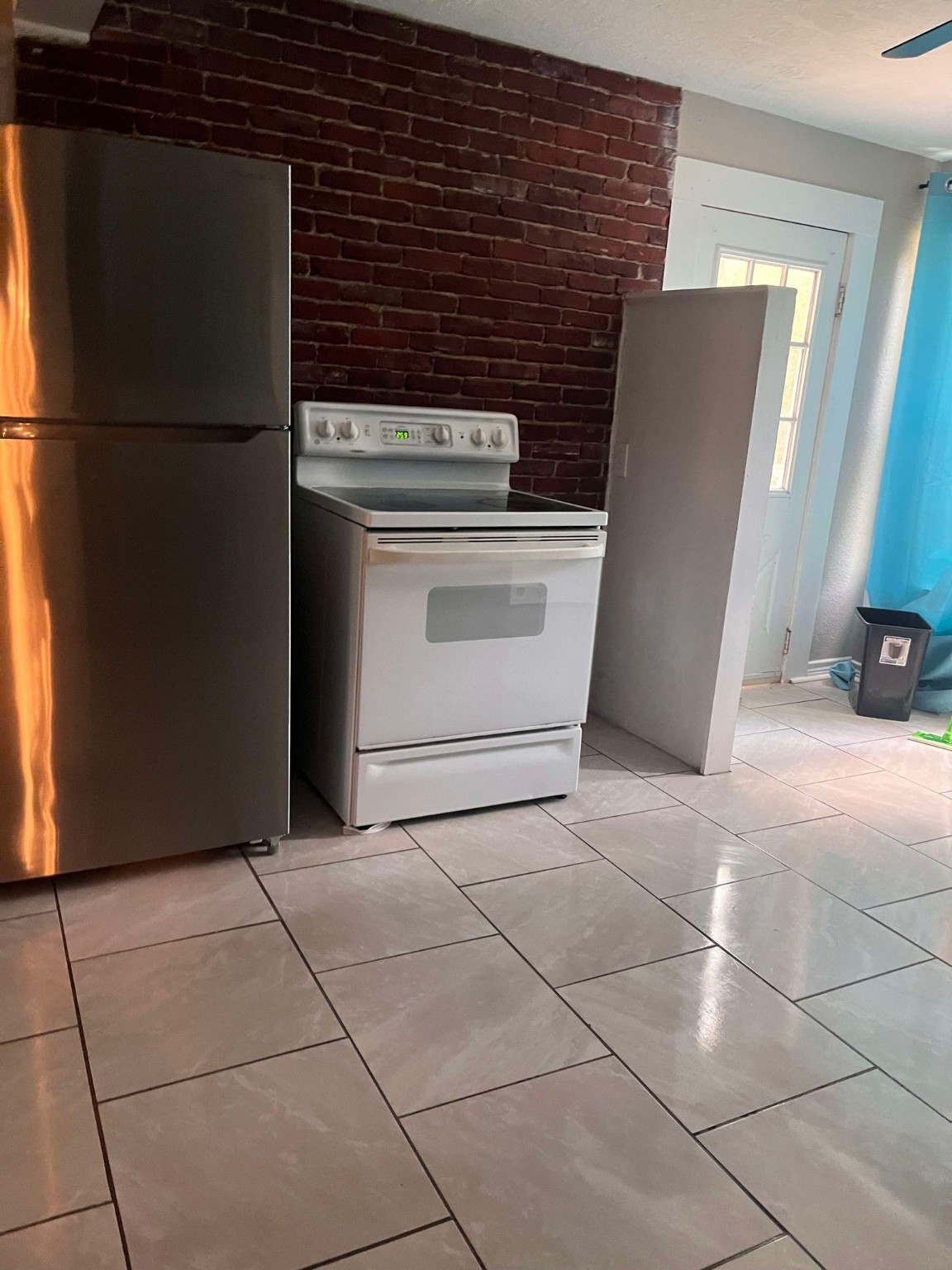 435 East Ave J Silsbee, TX 77656 - Photo 10 of 34 a kitchen with a stove and a refrigerator