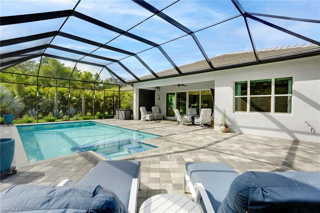 11413 Jacaranda Drive Naples, FL 34120 - Photo 33 of 50 a view of a house with a swimming pool