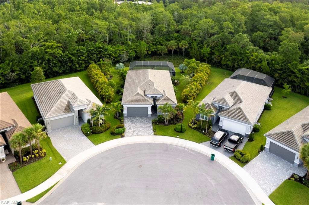 11413 Jacaranda Drive Naples, FL 34120 - Photo 38 of 50 an aerial view of a house with garden space and street view
