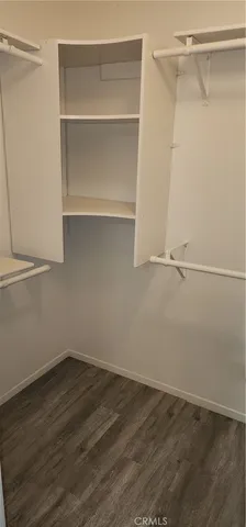 a view of wooden floor in an empty room