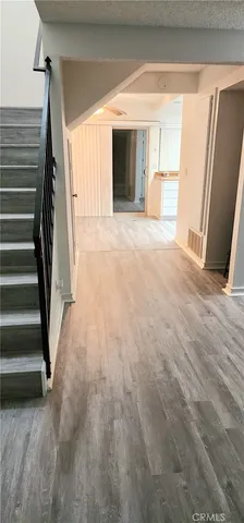 a view of a room with a furniture and stairs