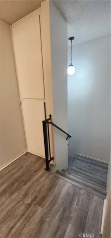 an empty room with wooden floor