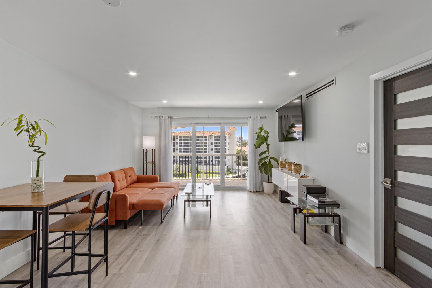2871 North Ocean Boulevard, Unit V443 Boca Raton, FL 33431 - Photo 15 of 49 a living room with furniture and a wooden floor