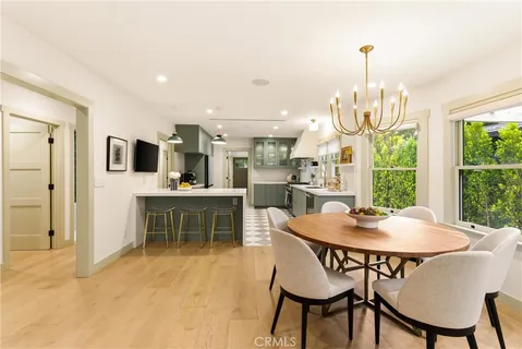 a kitchen with stainless steel appliances kitchen island granite countertop a sink and cabinets