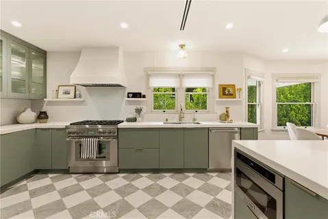 a kitchen with a cabinets and a refrigerator