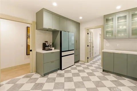 a kitchen with a sink a stove top oven a sink and a counter top space
