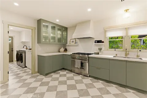 a kitchen with a sink a stove and refrigerator