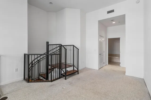 a view of a hallway with staircase
