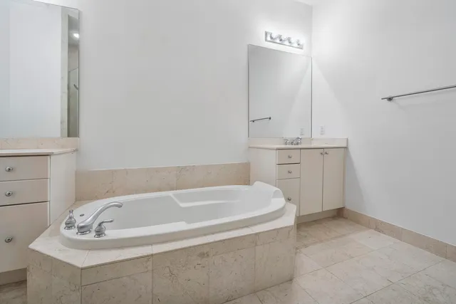 a spacious bathroom with bathtub