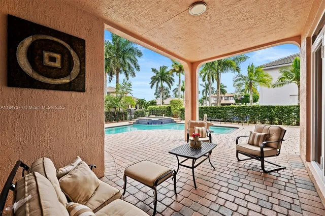 a view of a swimming pool with lounge chair