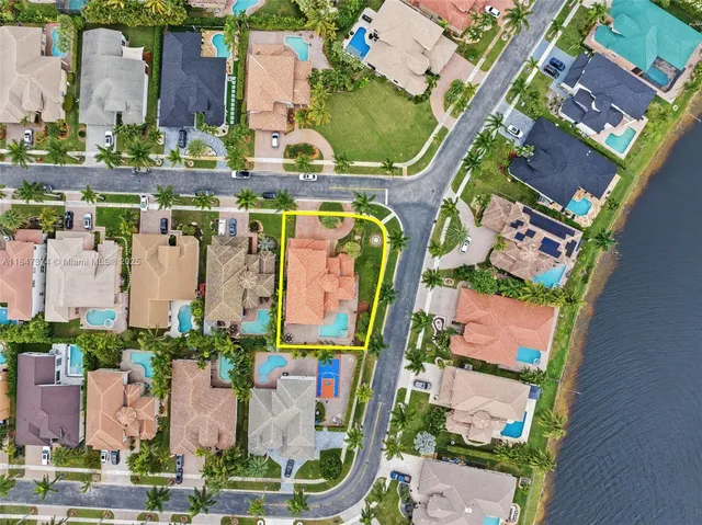 an aerial view of a house with a lake view