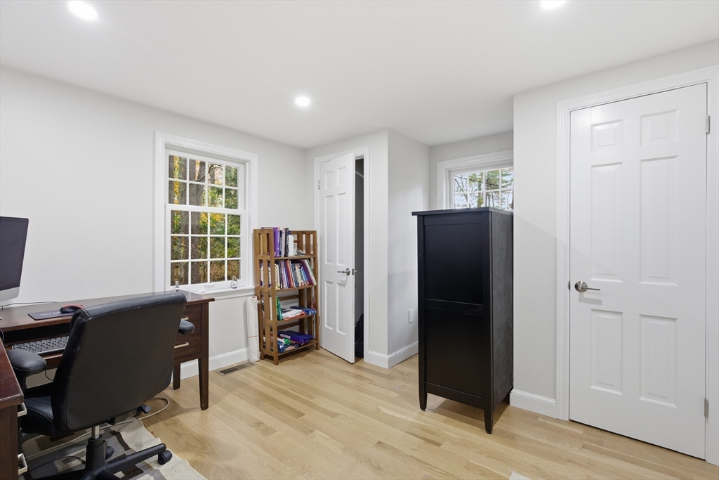 24 Woodland Road Sudbury, MA 01776 - Photo 26 of 42 a view of a workspace with furniture and wooden floor