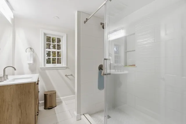 an aerial view of a house with a yard and garden