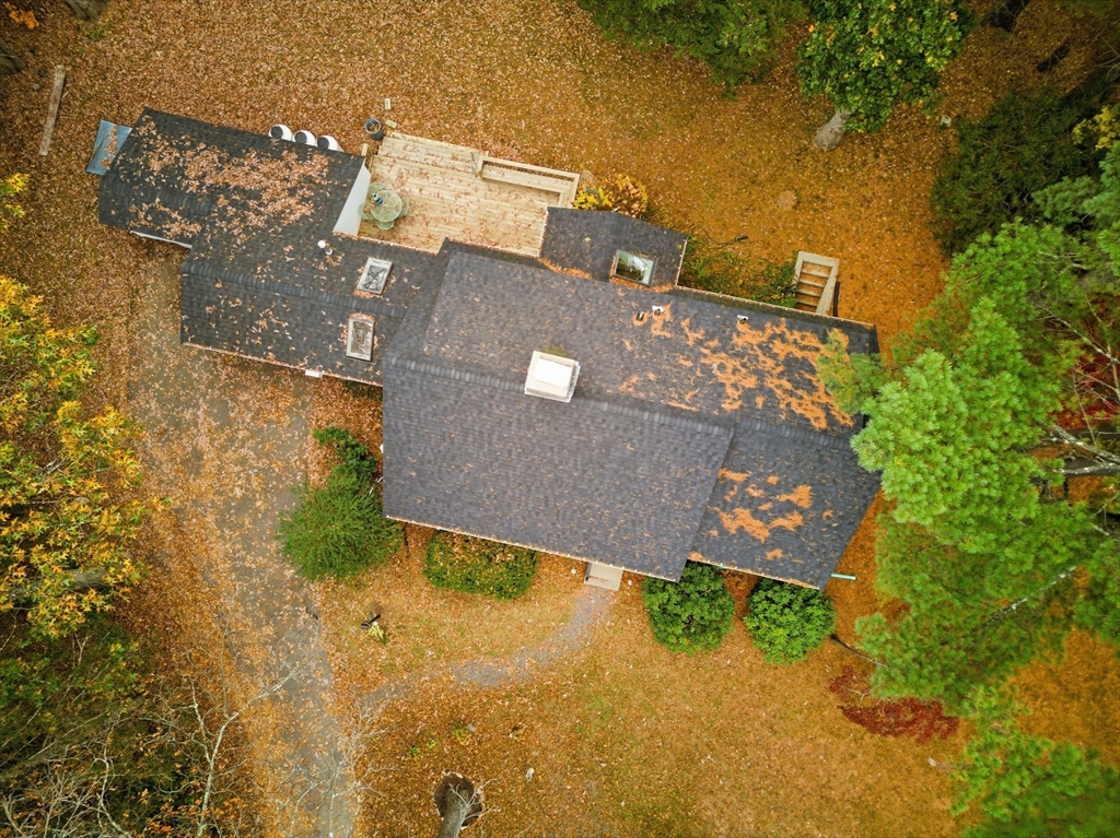 24 Woodland Road Sudbury, MA 01776 - Photo 39 of 42 an aerial view of a house with a yard and garden