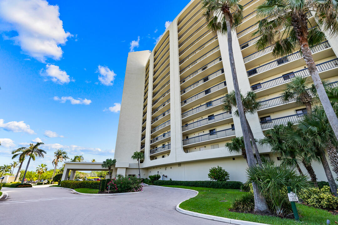400 Ocean Trail Way, Unit 1108 Jupiter, FL 33477 - Photo 37 of 41 a front view of a multi story residential apartment building with a yard