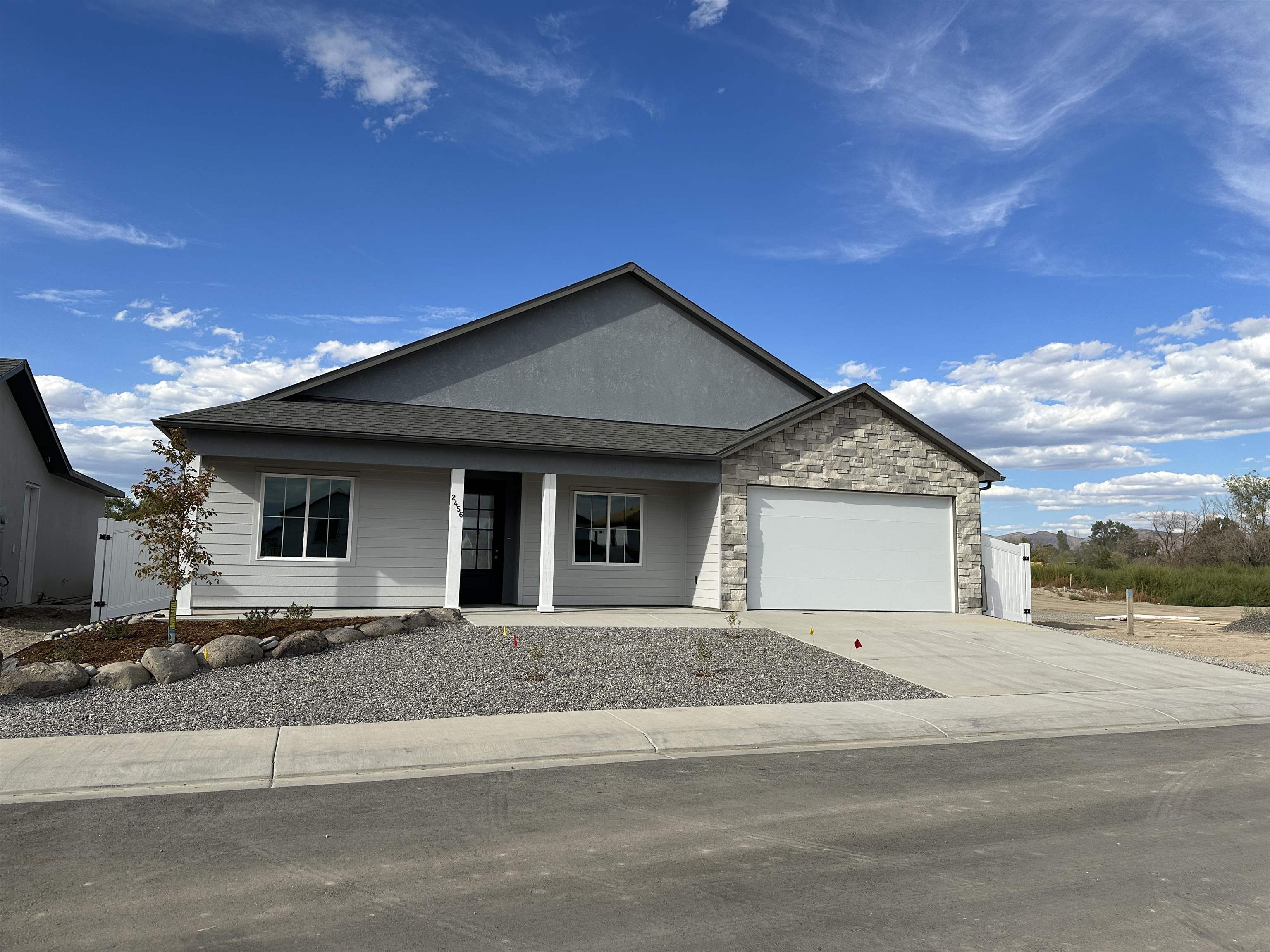 2456 Ross Road Grand Junction, CO 81505 - Photo 1 of 11 a front view of a house with a yard