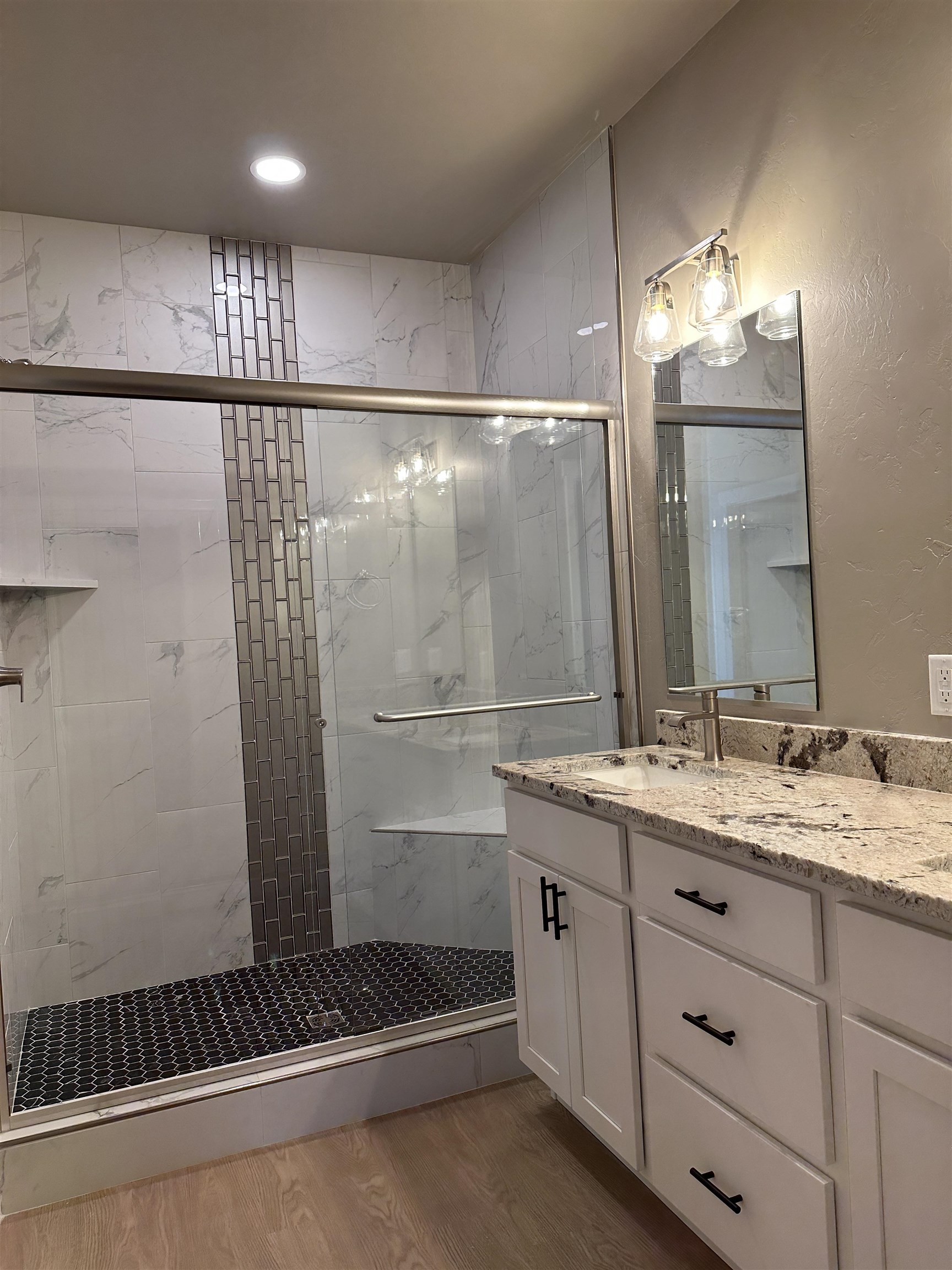 2456 Ross Road Grand Junction, CO 81505 - Photo 6 of 11 a bathroom with a double vanity sink and a mirror