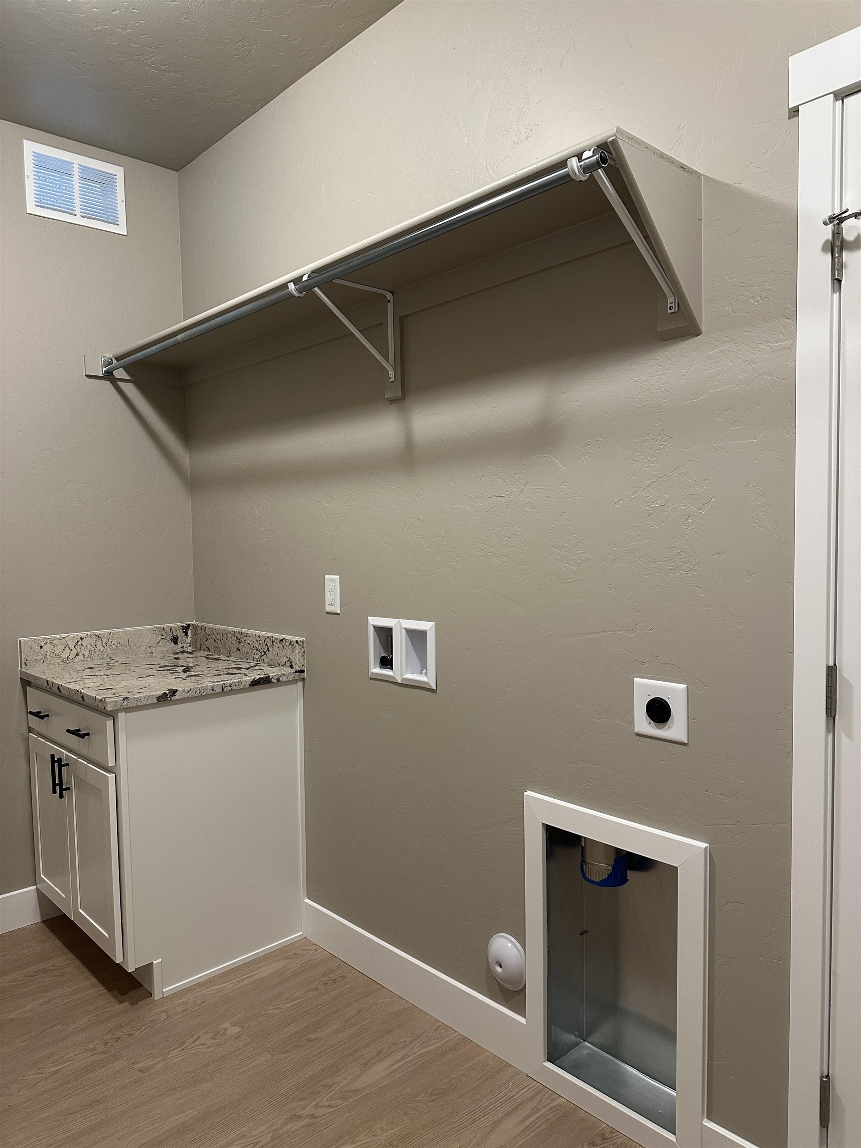 2456 Ross Road Grand Junction, CO 81505 - Photo 9 of 11 a kitchen with a stove and a microwave