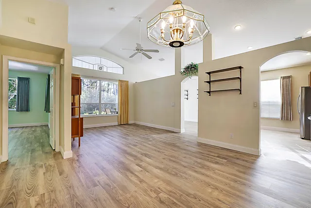wooden floor in an empty room and a mirror