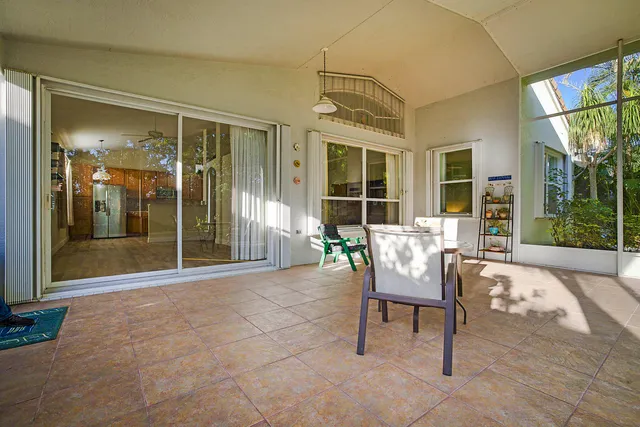 a balcony with furniture and a garden