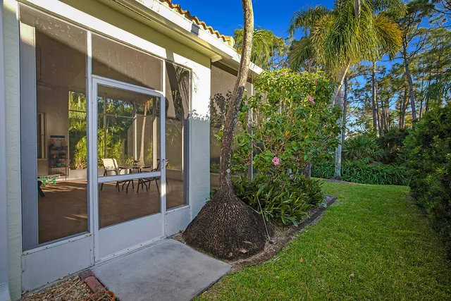 a view of a potted plants in front of a house