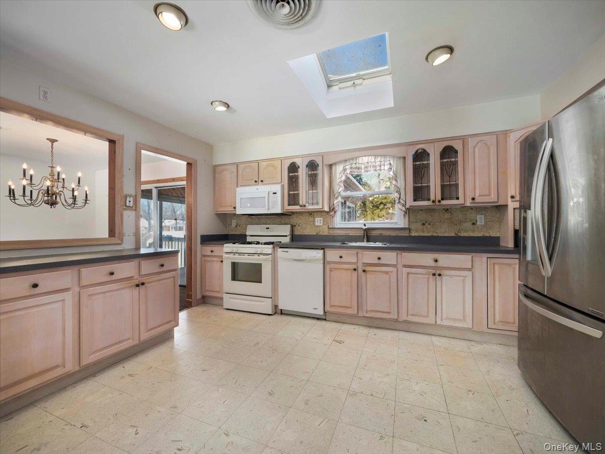 61 Rolling Ridge Road New City, NY 10956 - Photo 12 of 43 a large kitchen with stainless steel appliances granite countertop a stove a sink dishwasher and a refrigerator