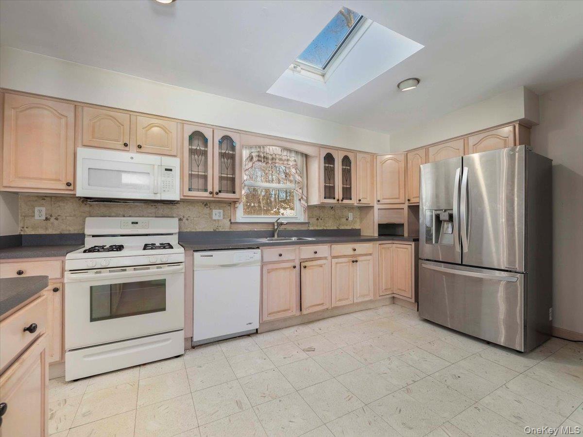 61 Rolling Ridge Road New City, NY 10956 - Photo 13 of 43 a kitchen with stainless steel appliances granite countertop a refrigerator sink stove and oven