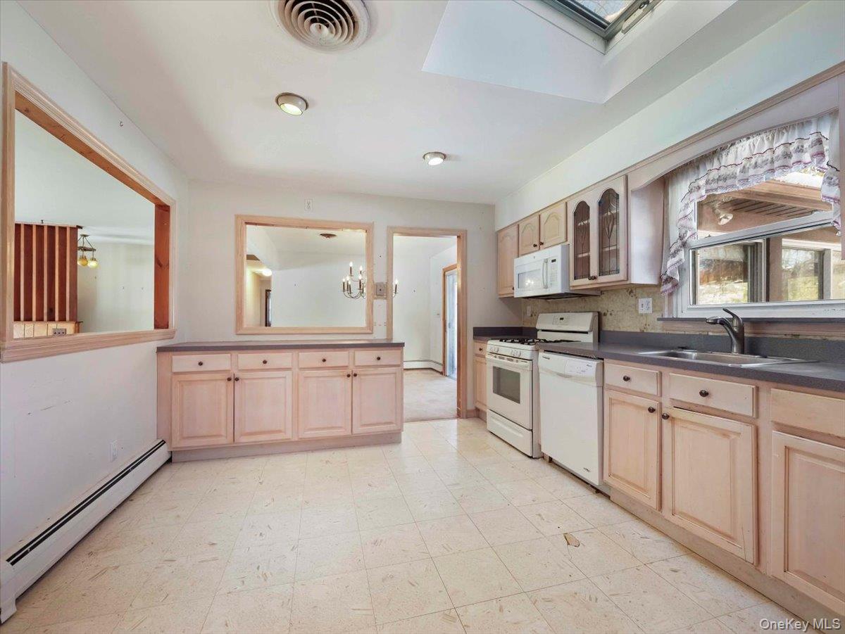 61 Rolling Ridge Road New City, NY 10956 - Photo 14 of 43 a large white kitchen with cabinets