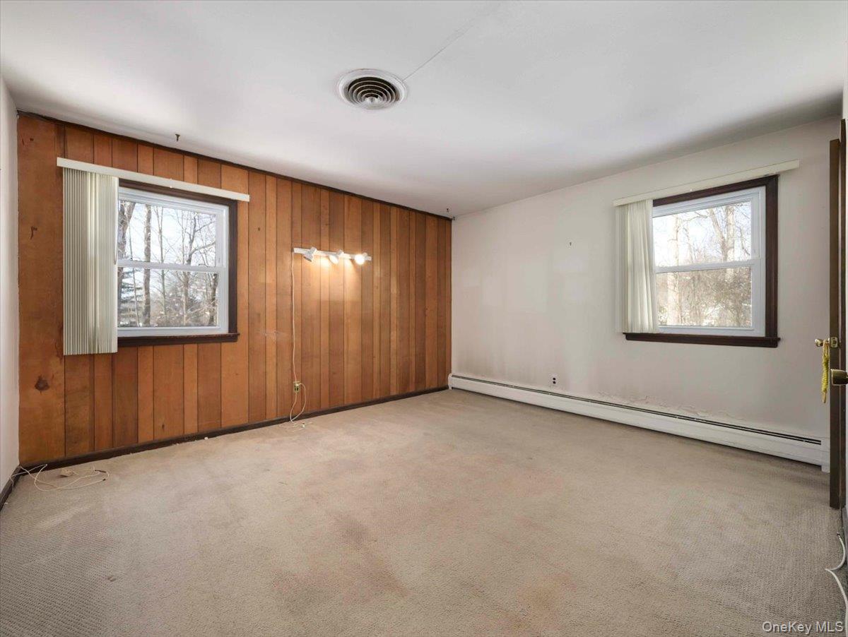 61 Rolling Ridge Road New City, NY 10956 - Photo 17 of 43 an empty room with windows and closet area