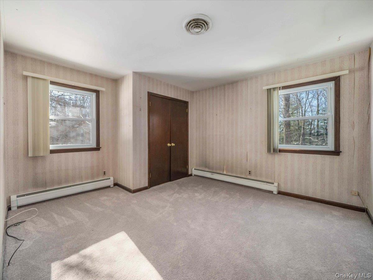 61 Rolling Ridge Road New City, NY 10956 - Photo 23 of 43 an empty room with windows