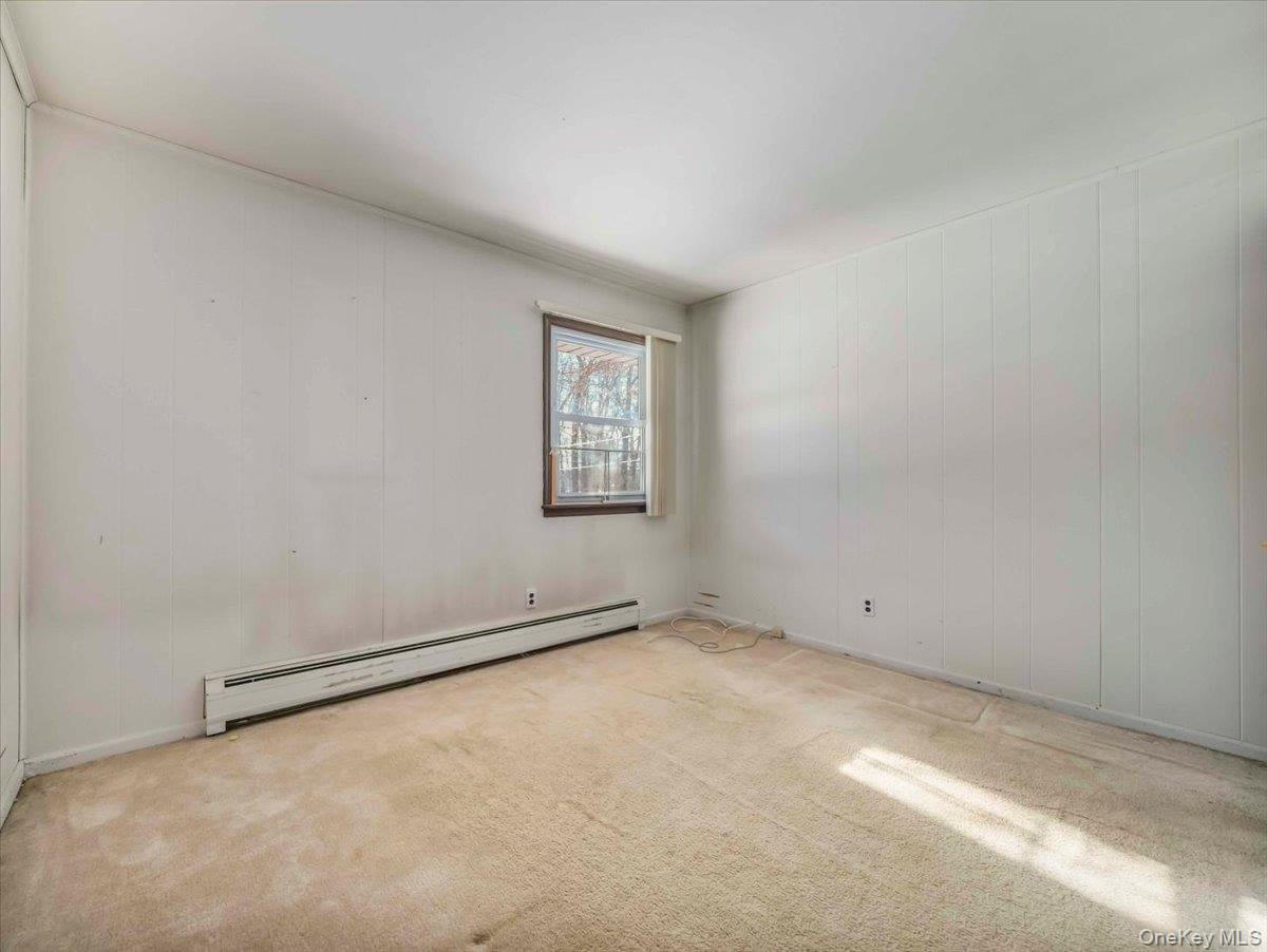 61 Rolling Ridge Road New City, NY 10956 - Photo 24 of 43 a view of an empty room with a window