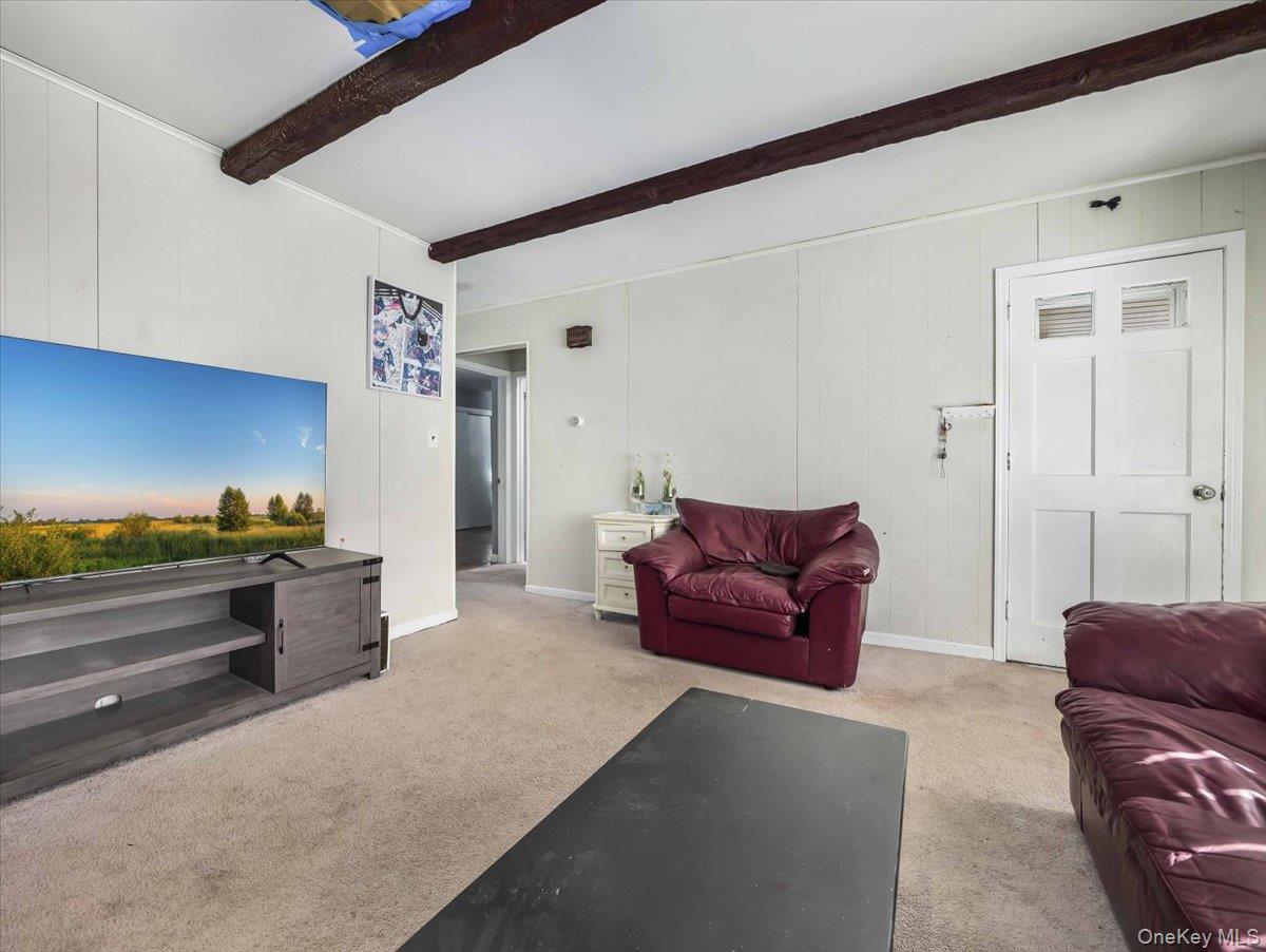 61 Rolling Ridge Road New City, NY 10956 - Photo 35 of 43 a living room with furniture and a couch