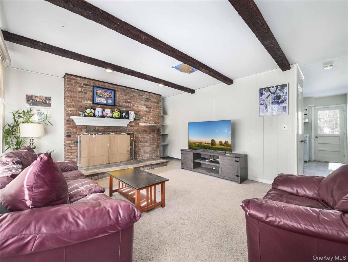 61 Rolling Ridge Road New City, NY 10956 - Photo 36 of 43 a living room with furniture and a flat screen tv