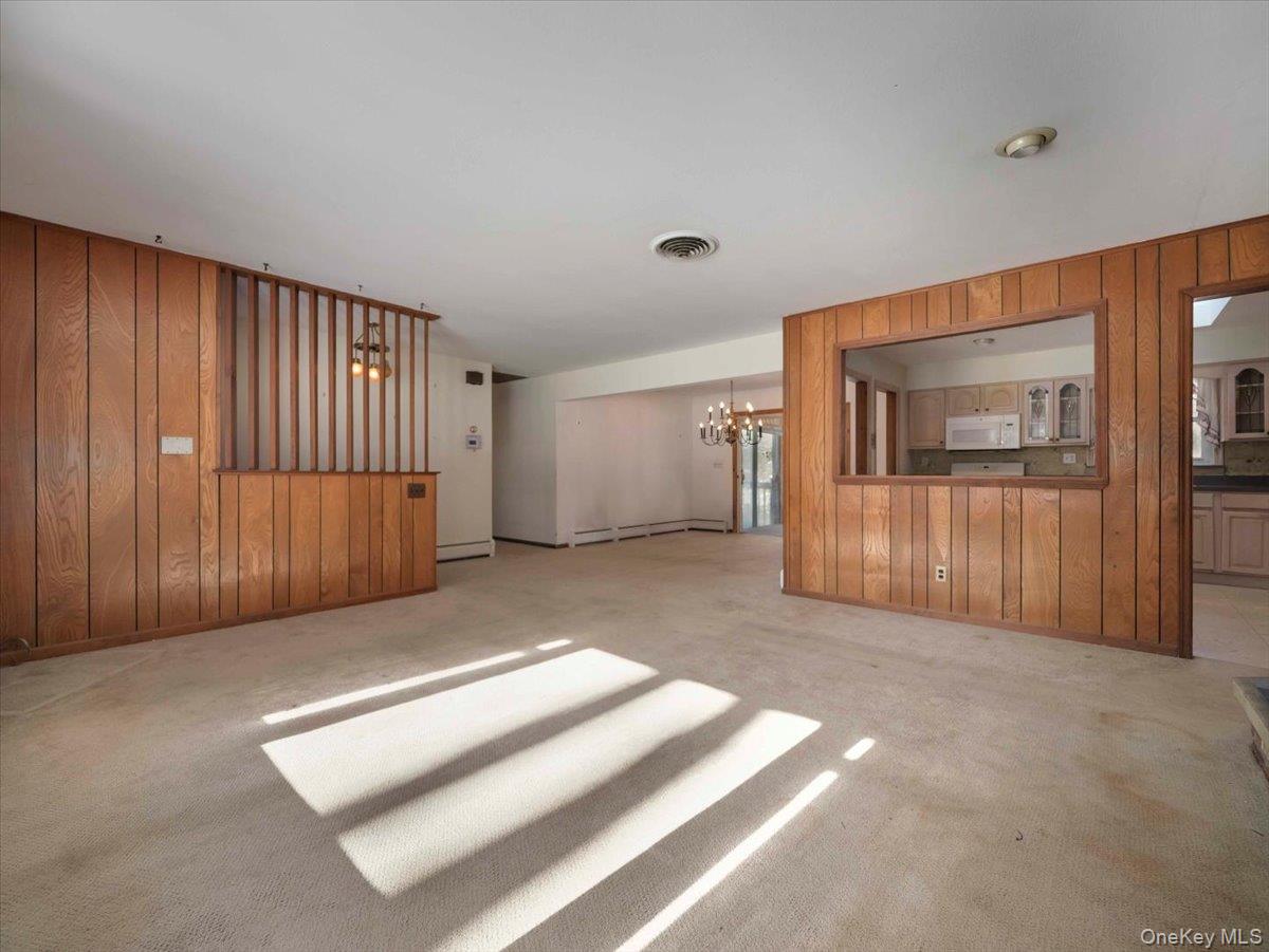 61 Rolling Ridge Road New City, NY 10956 - Photo 6 of 42 Additional view of Living Room showing the Dining Room and open airy feel to the kitchen