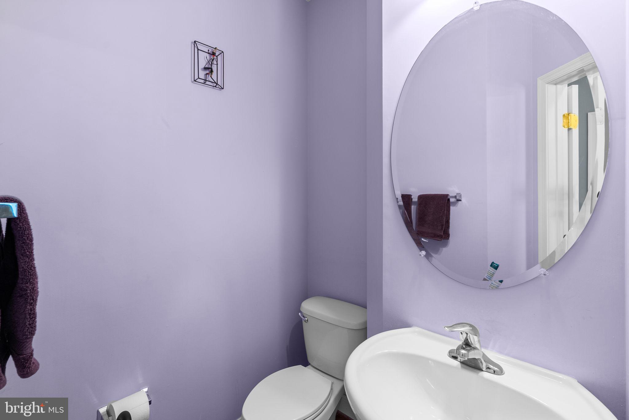 8301 Cedar View Court Clinton, MD 20735 - Photo 13 of 32 a bathroom with a toilet sink and mirror