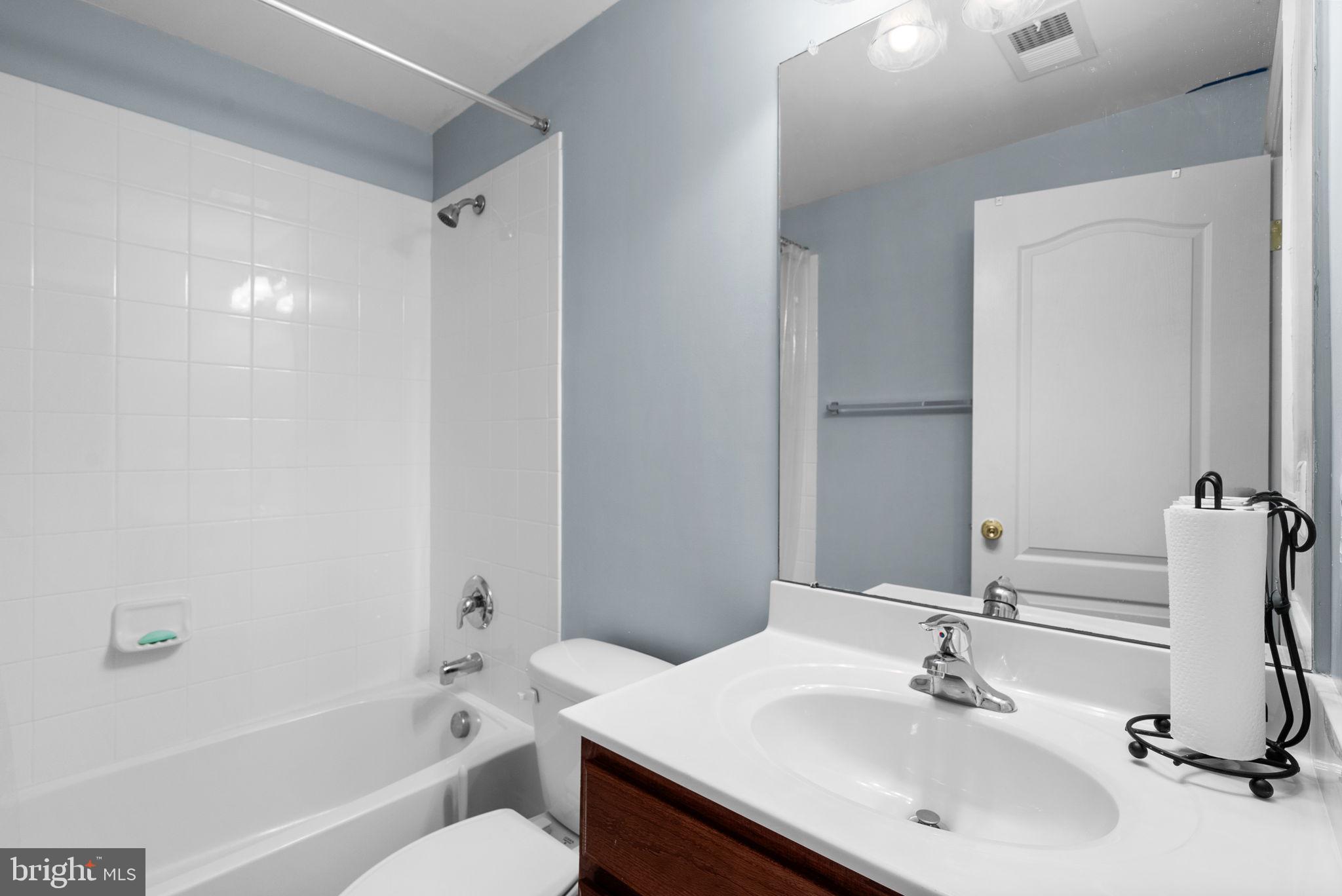 8301 Cedar View Court Clinton, MD 20735 - Photo 26 of 32 a bathroom with a sink toilet and shower