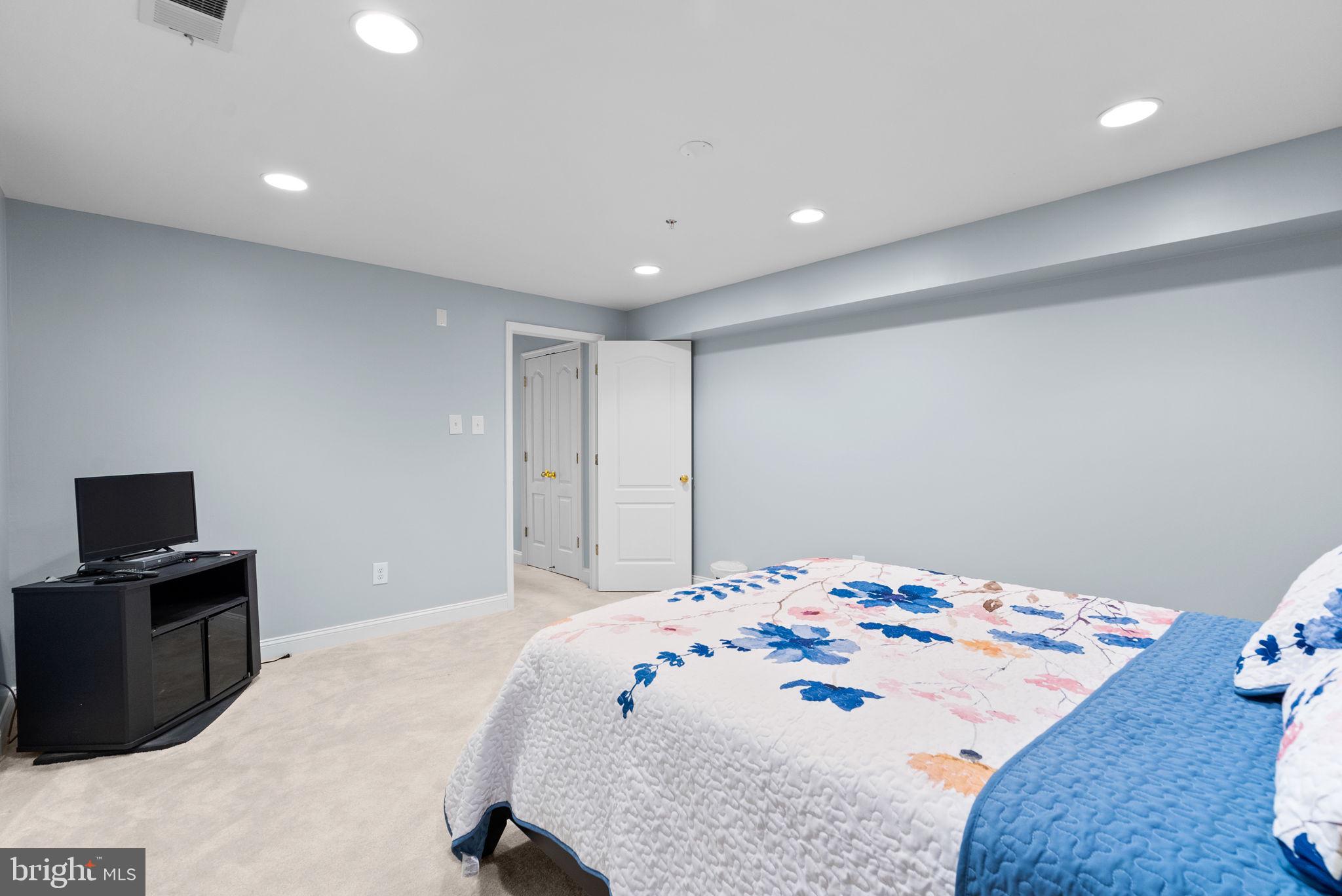 8301 Cedar View Court Clinton, MD 20735 - Photo 27 of 32 a bedroom with a bed and a tv