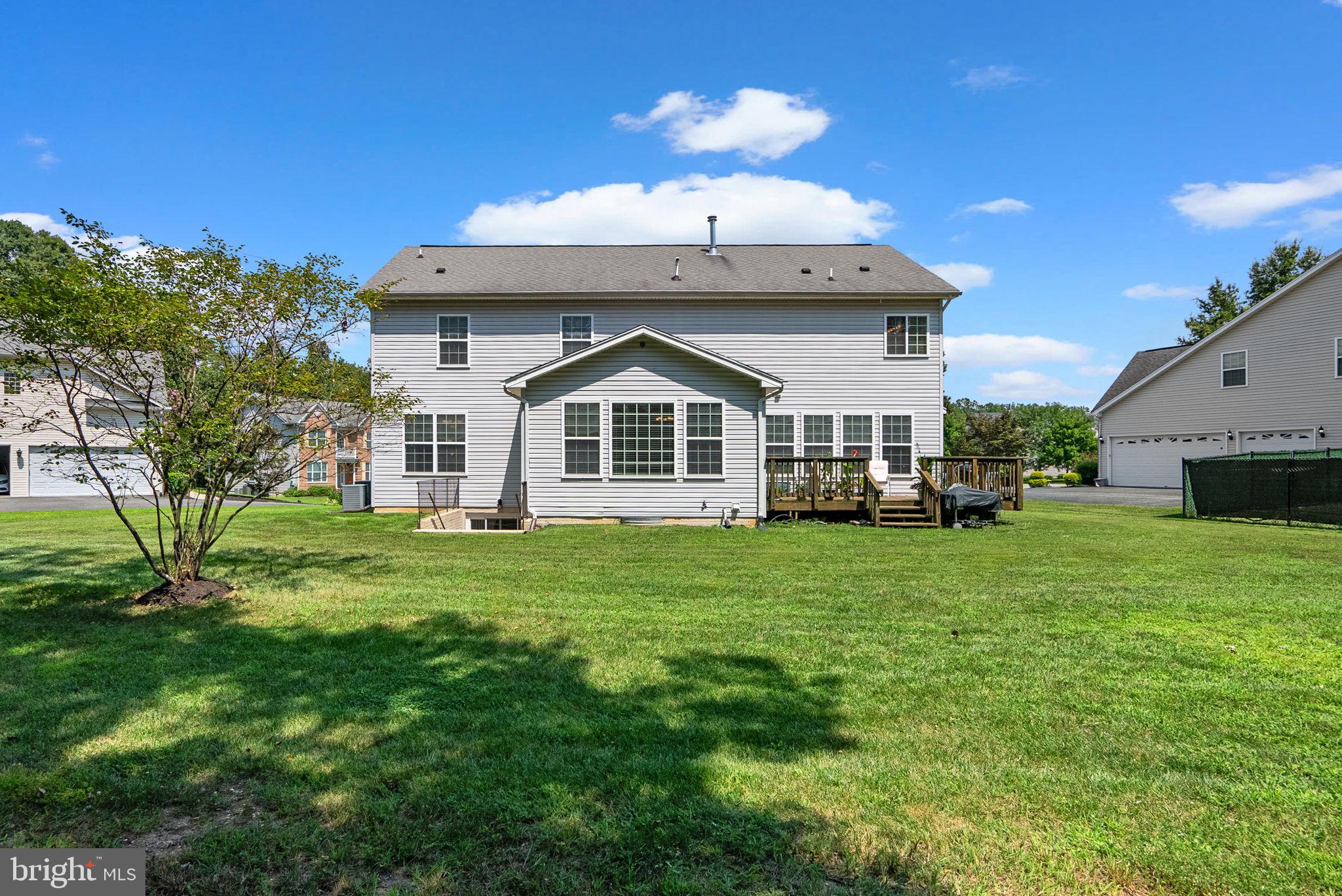 8301 Cedar View Court Clinton, MD 20735 - Photo 28 of 32 a view of a yard in front of a house with plants and large tree