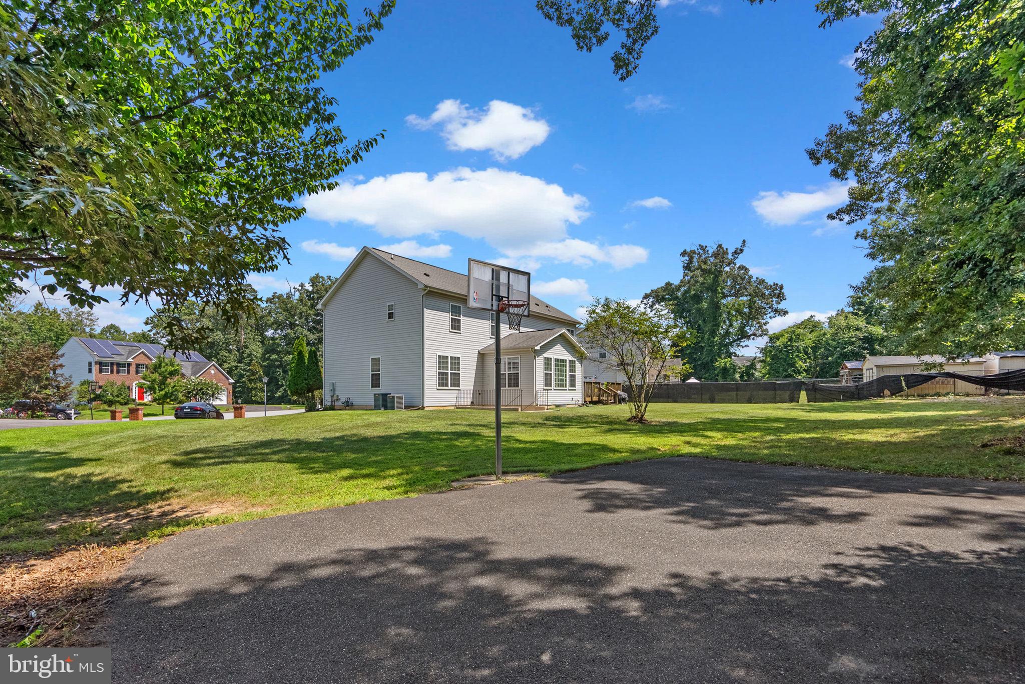 8301 Cedar View Court Clinton, MD 20735 - Photo 29 of 32 a front view of a house with a yard and garage