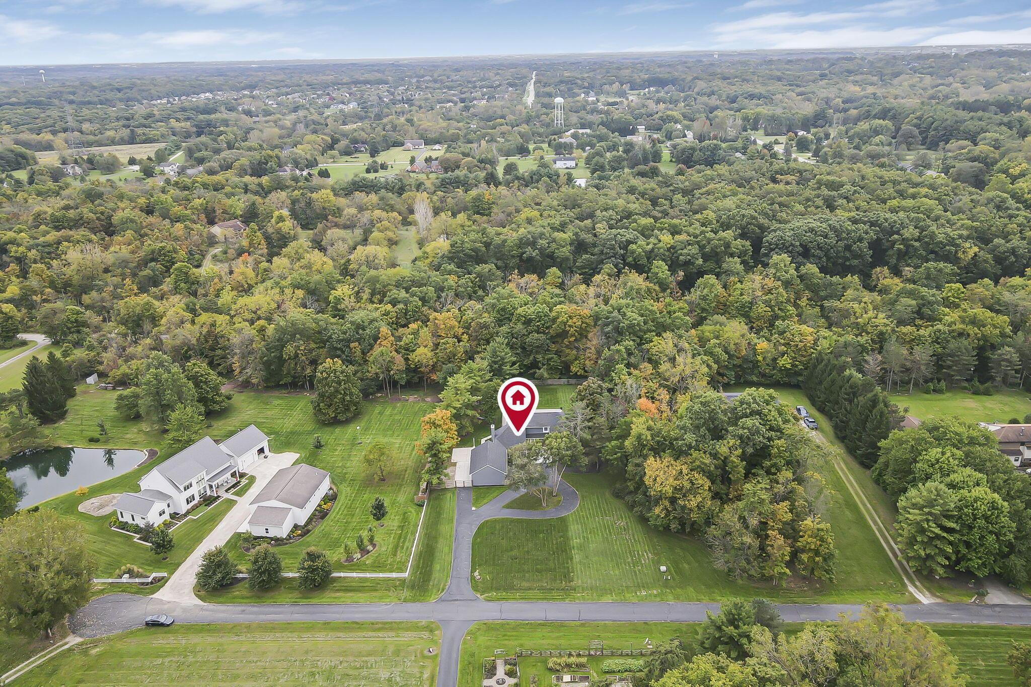 7140 Cook Road Powell, OH 43065 - Photo 79 of 87 Expansive lot with mature trees, a paved driveway, and substantial green space