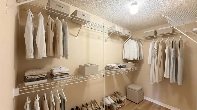 a bathroom with a sink a toilet and a shower