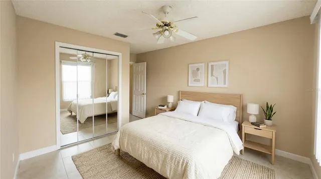 a bedroom with a bed and a table