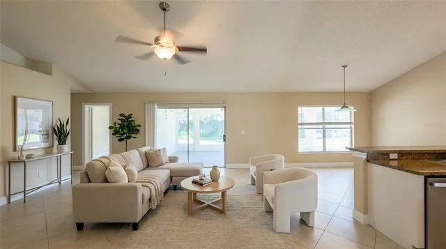 a living room with furniture and a window